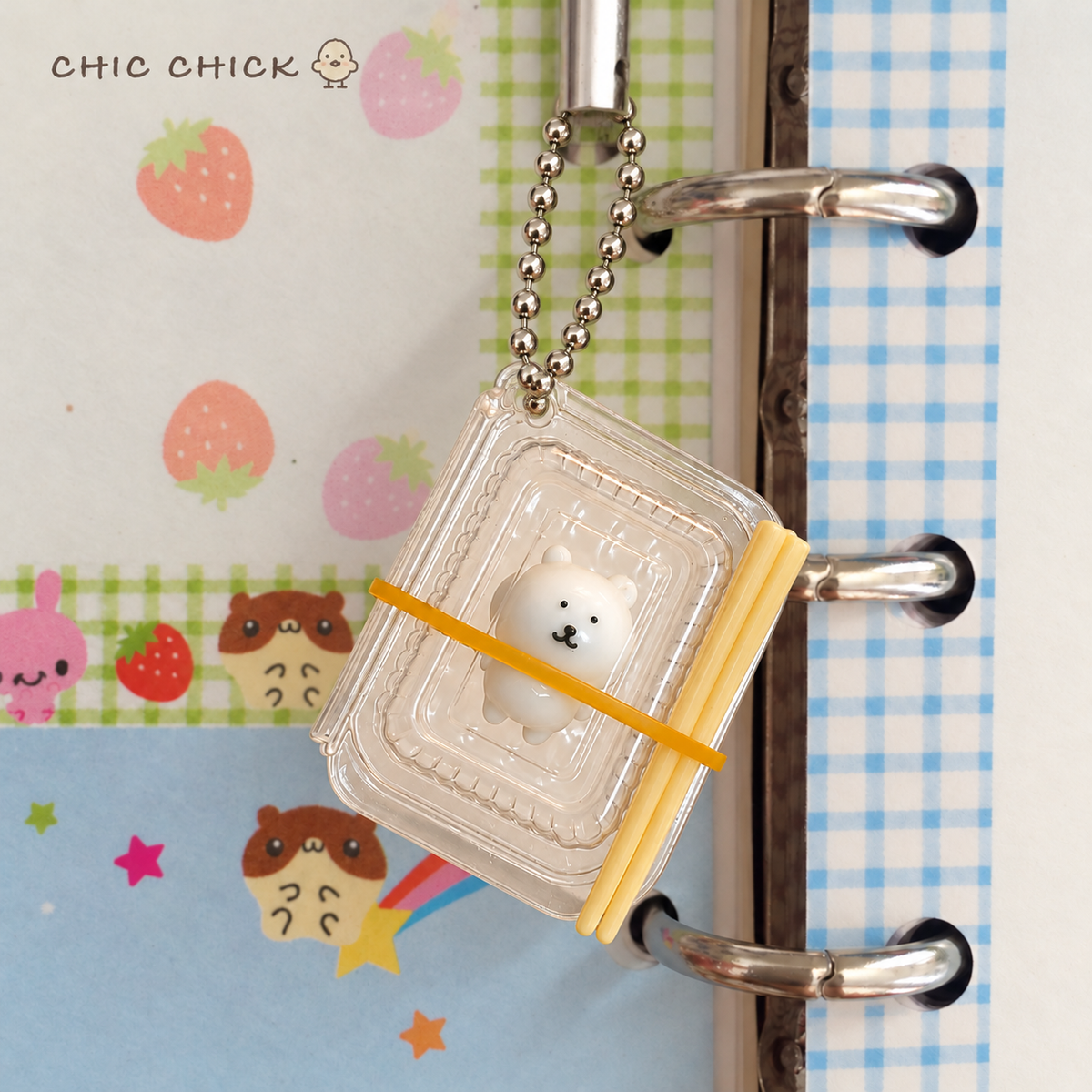 Tiny Bear Bento Squishy Charm hanging by its ball chain
