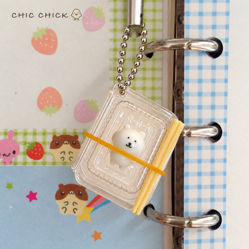 Tiny Bear Bento Squishy Charm hanging by its ball chain